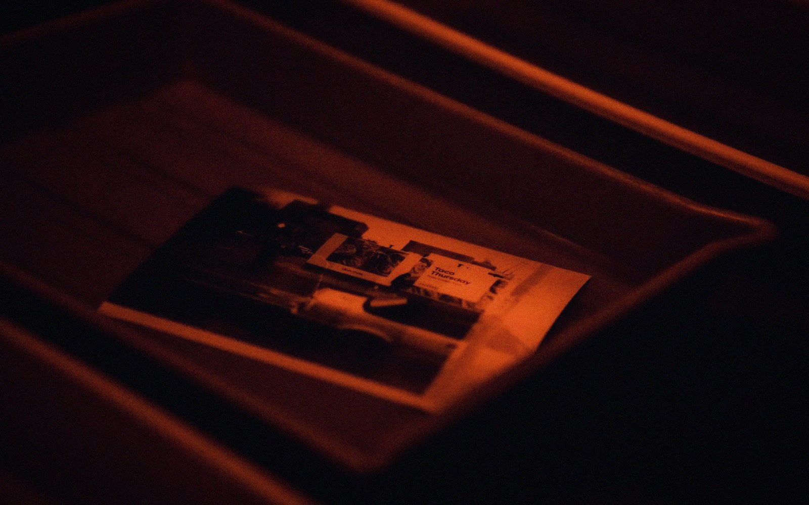 Prints face-up in a developing tray